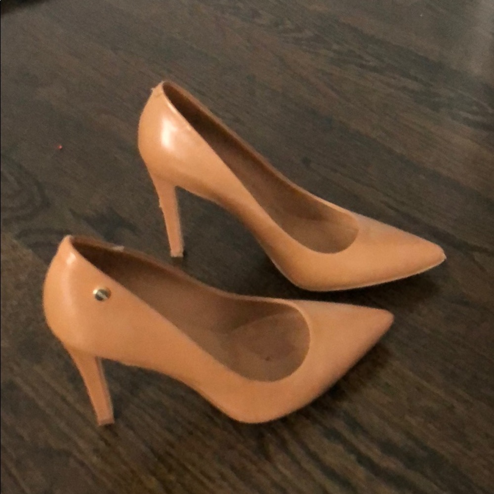 Worn twice pumps